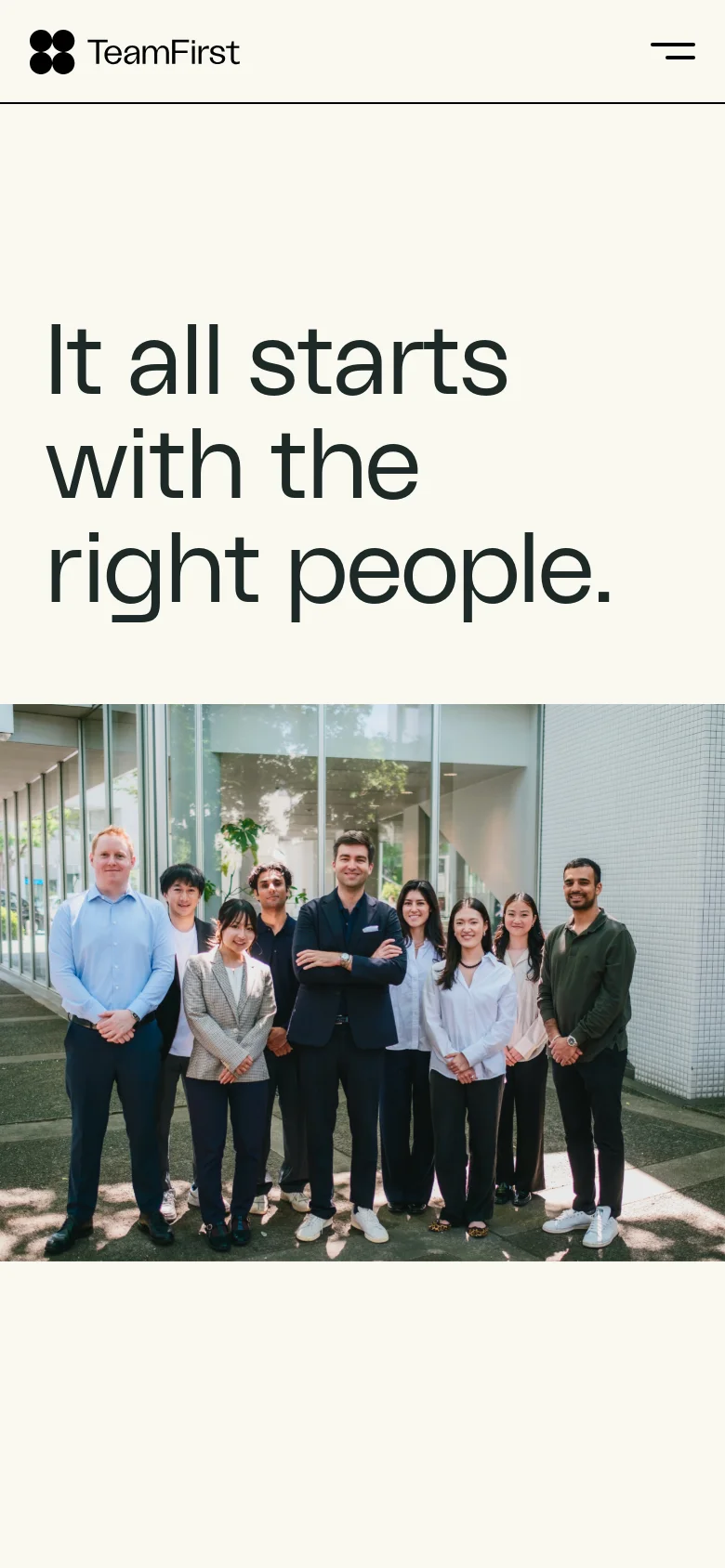 The mobile version simplifies the layout, replacing the top navigation bar with a hamburger menu icon next to the TeamFirst logo. The hero headline and group photo are stacked vertically, with the text appearing larger and more prominent above the image.