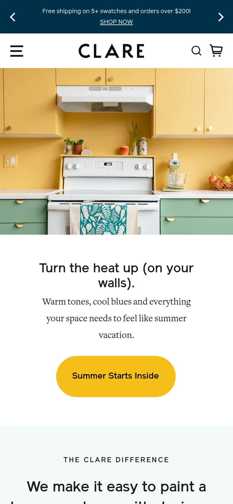 The mobile version presents a vertically stacked layout, starting with a hero image of the yellow and green kitchen. Below the image, the headline 'Turn the heat up (on your walls)' and descriptive text are centered above a large, rounded yellow 'Summer Starts Inside' button. The navigation is condensed into a hamburger menu icon on the left, with search and cart icons on the right.
