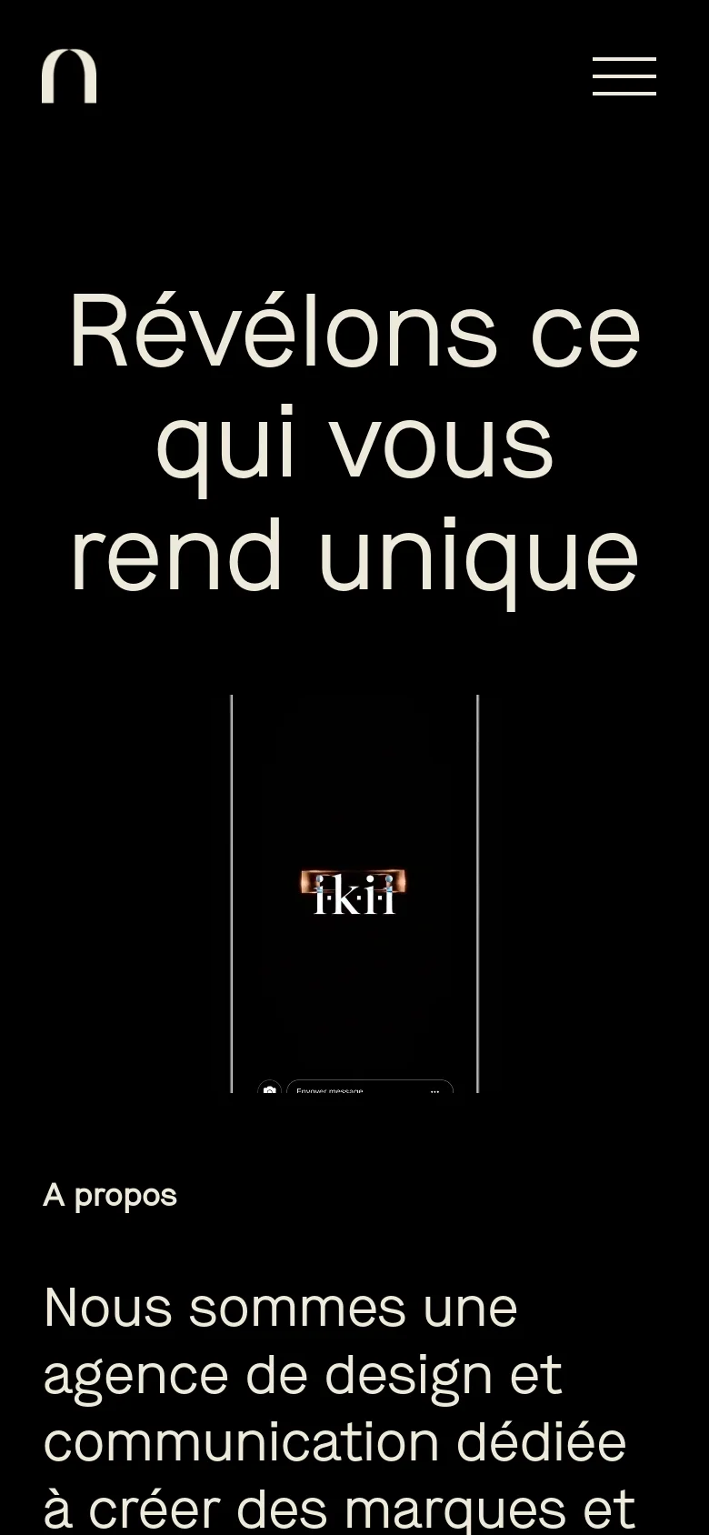 The mobile version presents a vertically stacked layout with the large white headline prominently displayed at the top against a black background. The navigation menu is condensed into a white hamburger icon in the top right corner. The hero imagery and subsequent content sections are scaled to fit a narrow portrait orientation, maintaining the high-contrast black and white aesthetic.