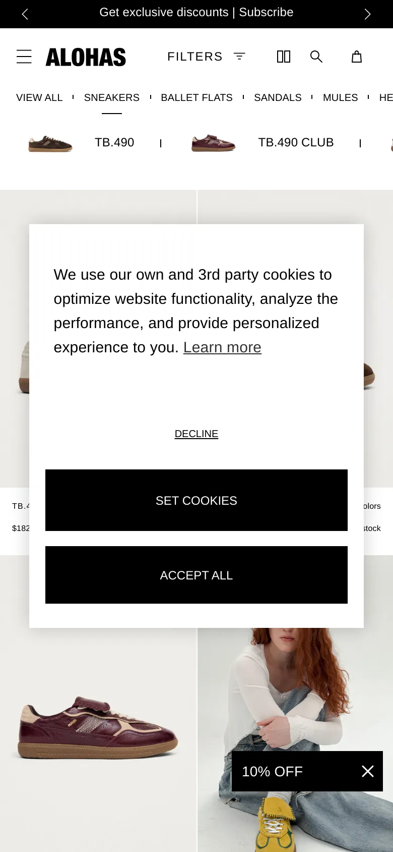 The mobile version presents a simplified vertical layout with a hamburger menu and a single-column product grid. The top navigation is condensed into a scrollable list of categories, and a large cookie consent pop-up overlays the center of the screen. A small '10% OFF' promotional banner is visible at the bottom of the viewport.