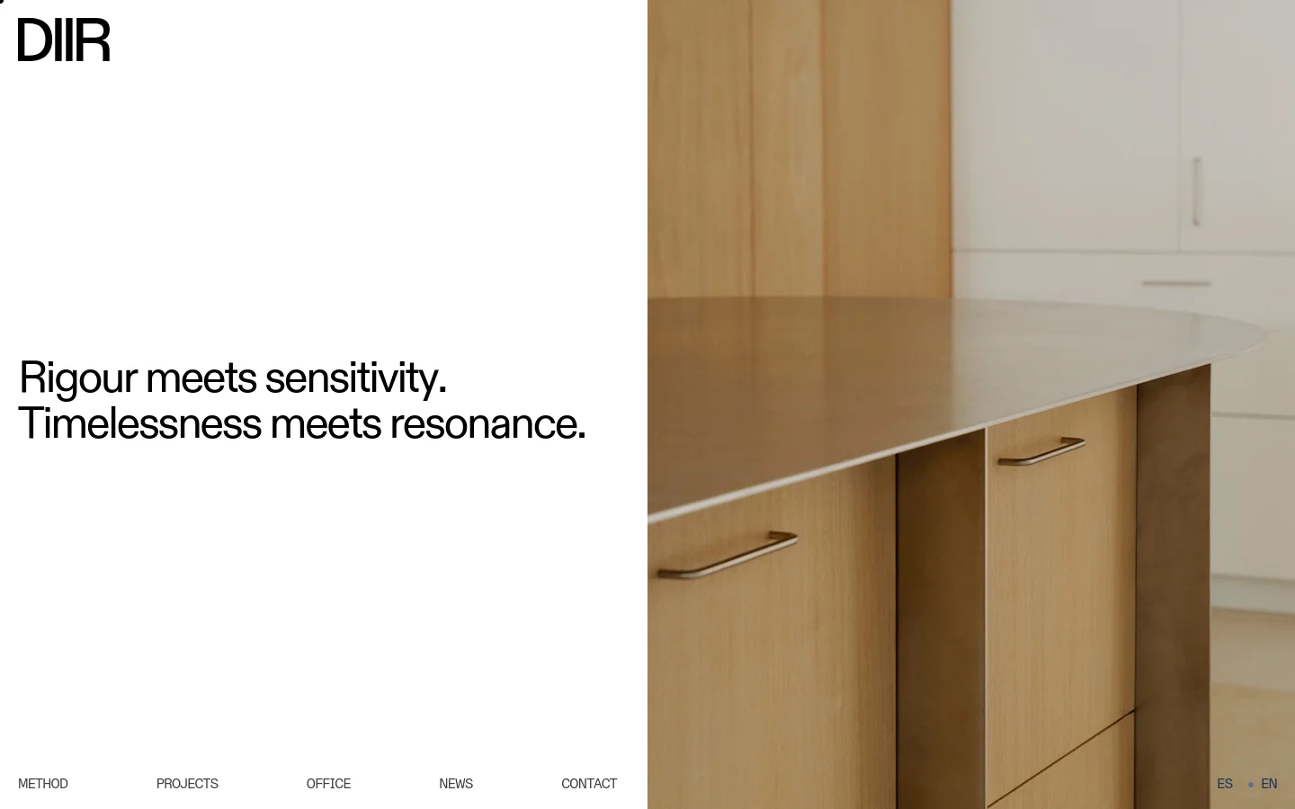 The DIIR homepage features a minimalist layout with a split screen. The left side is white with the 'DIIR' logo, the headline 'Rigour meets sensitivity. Timelessness meets resonance.', and a bottom navigation menu. The right side shows a high-quality photograph of a modern kitchen with light wood cabinetry and a smooth countertop.