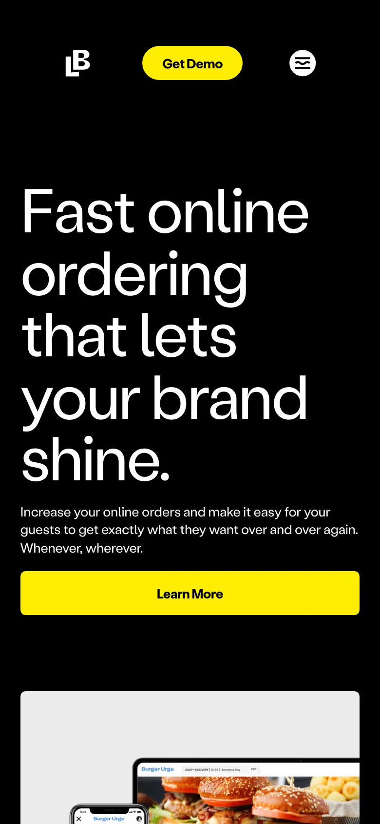 The mobile version presents a vertical layout with the large white headline and subheadline stacked above a full-width yellow 'Learn More' button. The black background dominates the top half, while the product imagery of the laptop and smartphone is positioned below the primary call to action. The navigation is simplified, focusing on the brand logo and the prominent yellow 'Get Demo' button.