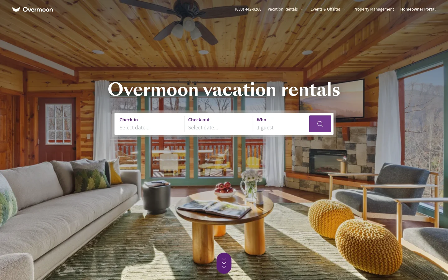 The Overmoon homepage features a large hero image of a cozy, sunlit wood-paneled living room with a view of nature. A white booking widget for check-in, check-out, and guest count is centered over the image, topped by the headline 'Overmoon vacation rentals'. The navigation bar at the top includes the company logo, phone number, and links for vacation rentals, events, property management, and a homeowner portal.
