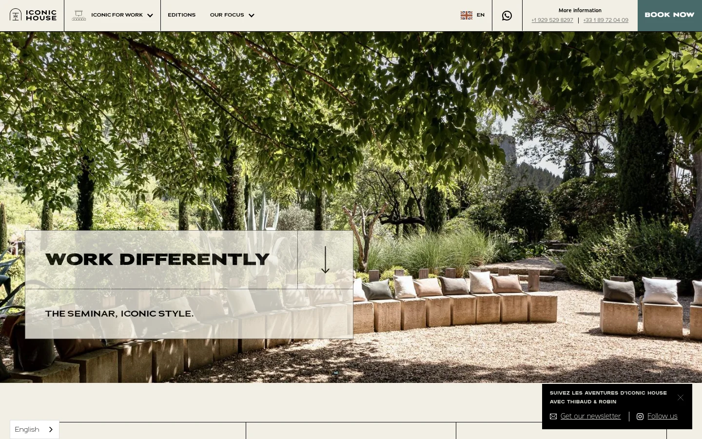 The desktop website features a large hero image of a lush, sunlit garden with outdoor seating, overlaid with the headline 'WORK DIFFERENTLY' and the subheadline 'THE SEMINAR, ICONIC STYLE.' A navigation bar at the top includes the Iconic House logo, menu links like 'Iconic For Work' and 'Editions,' a language selector, and a prominent 'BOOK NOW' call to action button. The color palette is natural and earthy, dominated by greens and beige.