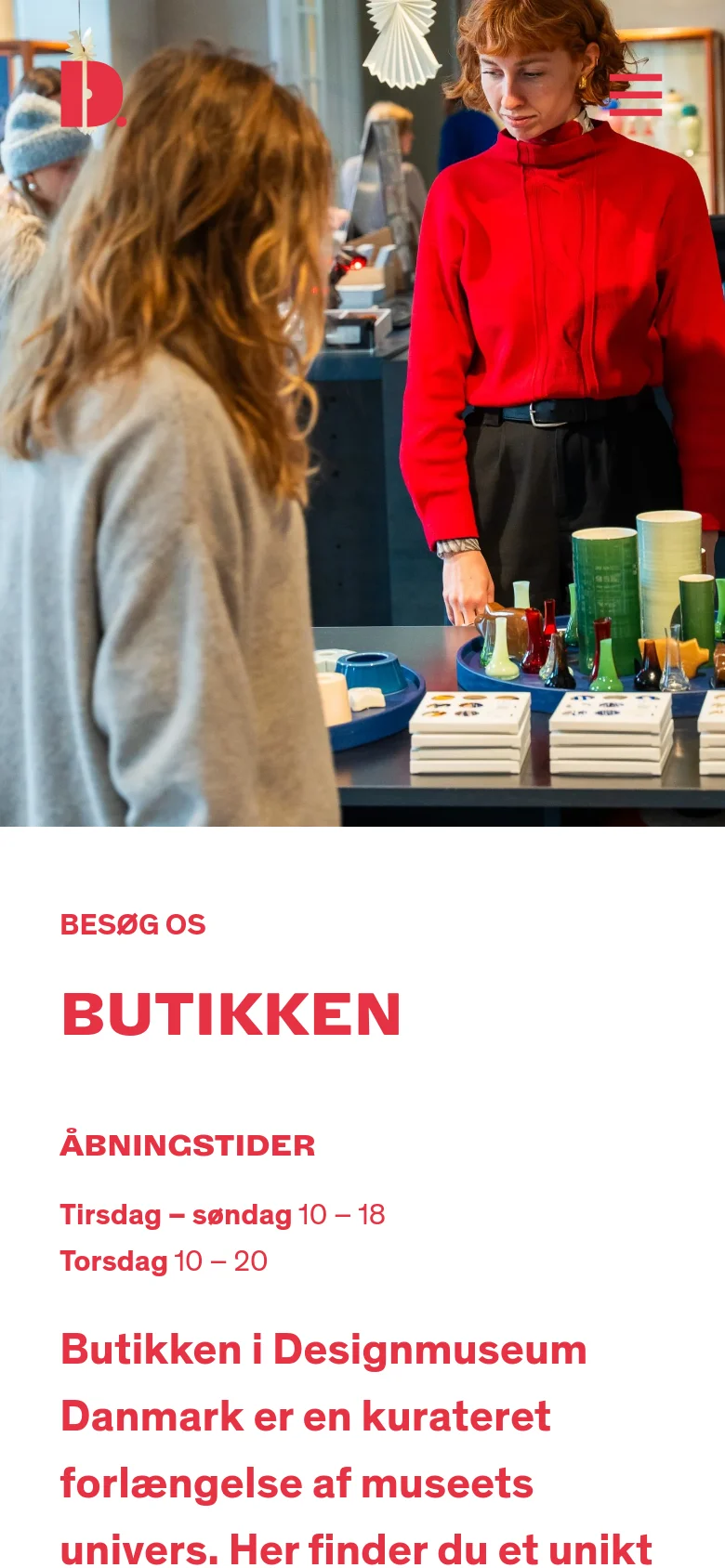 The mobile version presents a vertical stack, starting with a full-width hero image of shoppers in the museum shop. Below the image, the red 'BUTIKKEN' headline and 'ÅBNINGSTIDER' section are centered, followed by the introductory text, creating a simplified single-column scrolling experience.