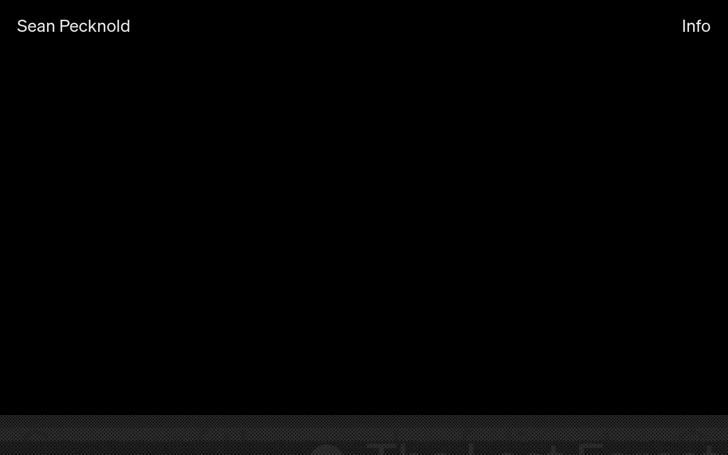 The homepage features a minimalist black background with the name 'Sean Pecknold' in white text on the left and an 'Info' link on the right. Below the header, a large grid of video players displays various animation and film projects, such as 'The Lost Forest' and 'Tennis, Oranges'.