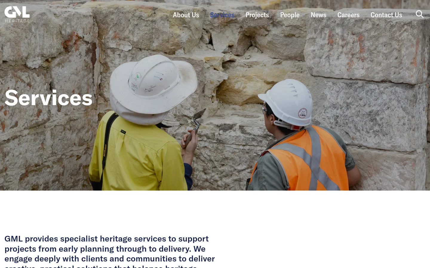 The desktop page features a large hero image of two workers in hard hats and high-visibility vests examining a stone wall, with the headline 'Services' overlaid in white. Below, a text section introduces GML's heritage services, followed by a grid of service cards including First Nations Heritage, History, and Archaeology, each with an image and a 'Find out more' link. The navigation menu is horizontal at the top right, and the color palette is professional with earth tones and white.