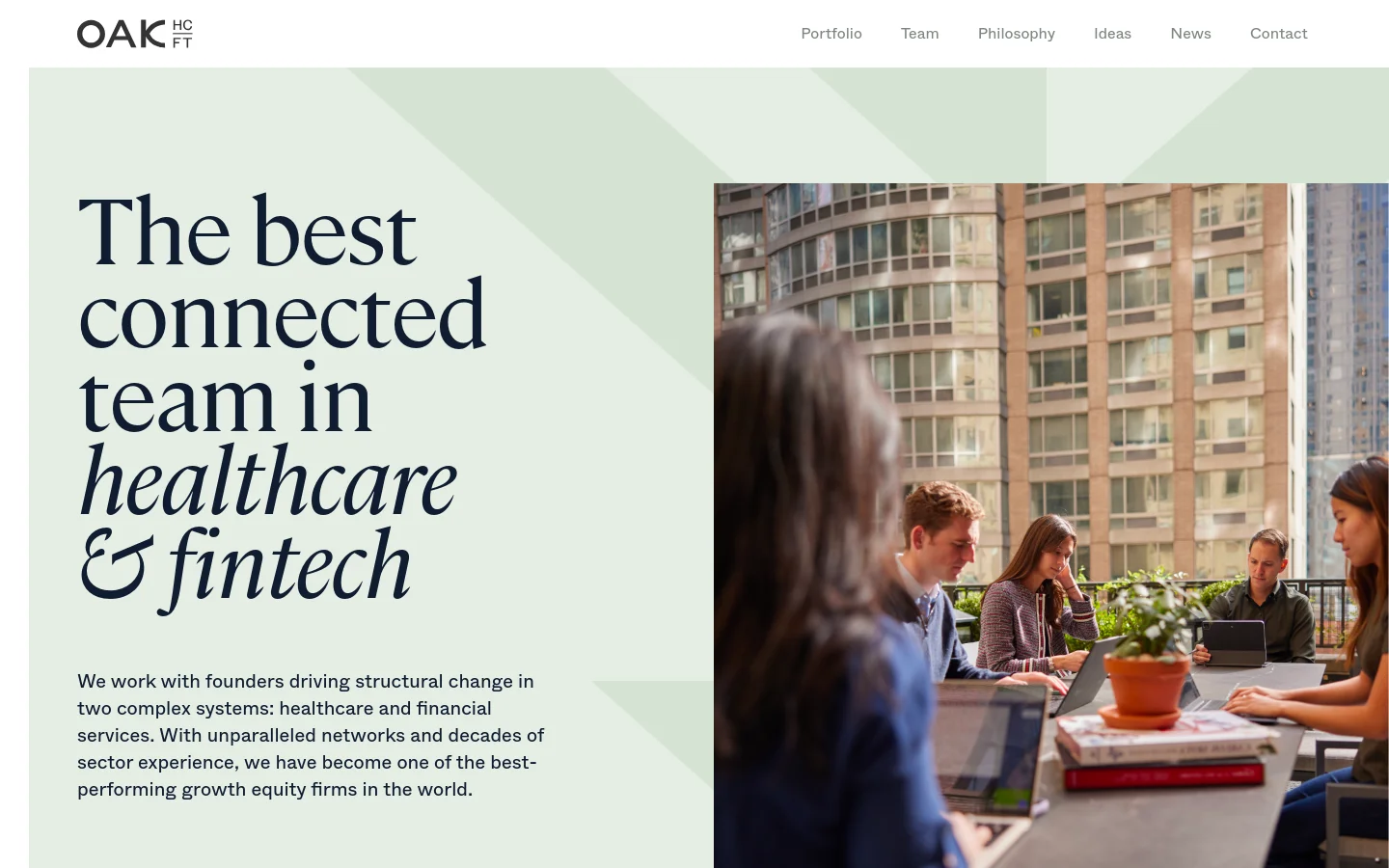Desktop homepage for Oak HC/FT featuring a minimalist design with a light sage green background. A large headline reads 'The best connected team in healthcare & fintech' next to a hero image of professionals working in a modern office setting with city buildings in the background. The navigation menu at the top includes links for Portfolio, Team, Philosophy, Ideas, News, and Contact.