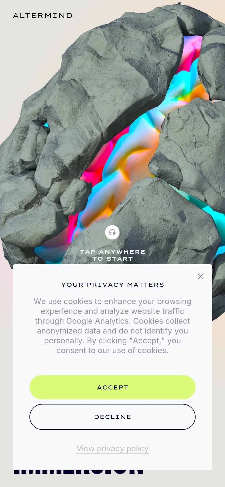 The mobile version presents a vertically oriented view of the same 3D rock imagery with vibrant neon lighting. The text and interactive elements are scaled for a smaller screen, and the privacy consent banner occupies a larger portion of the lower viewport compared to the desktop version.