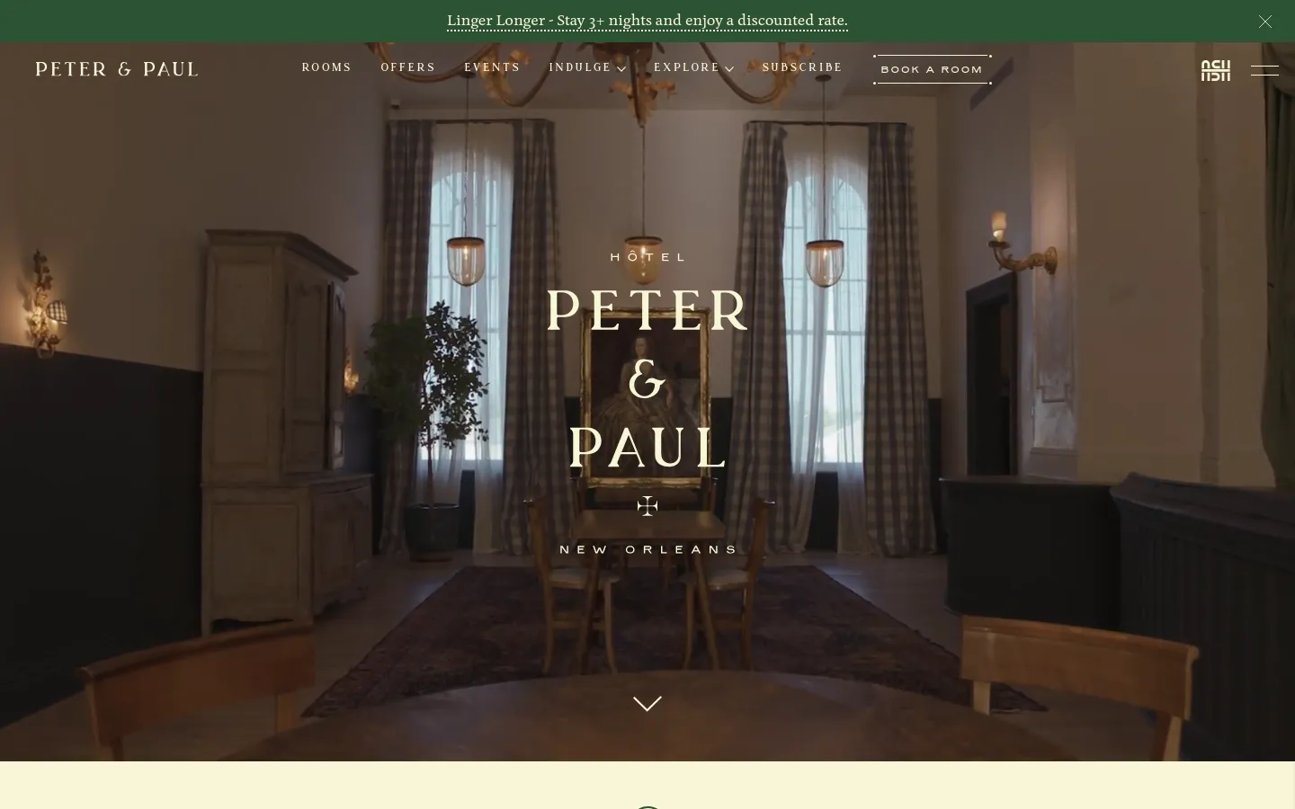 The desktop homepage features a full-width hero image of a sophisticated, dimly lit hotel interior with large windows, elegant furniture, and a central portrait. The 'Hotel Peter & Paul New Orleans' headline is centered in large serif typography over the image, with a navigation menu at the top containing links like Rooms, Offers, and Events, and a 'Book a Room' button. A thin promotional banner at the very top offers a discount for stays of three nights or more.
