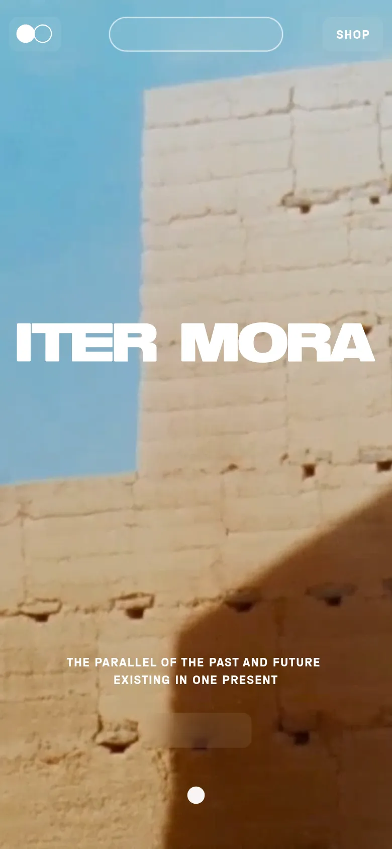 The mobile version presents a vertically stacked layout with the 'ITER MORA' branding and tagline prominently centered over a large background image of stone ruins. The 'SHOP' button and navigation elements are scaled for touch, and the hero imagery occupies the full width of the screen.