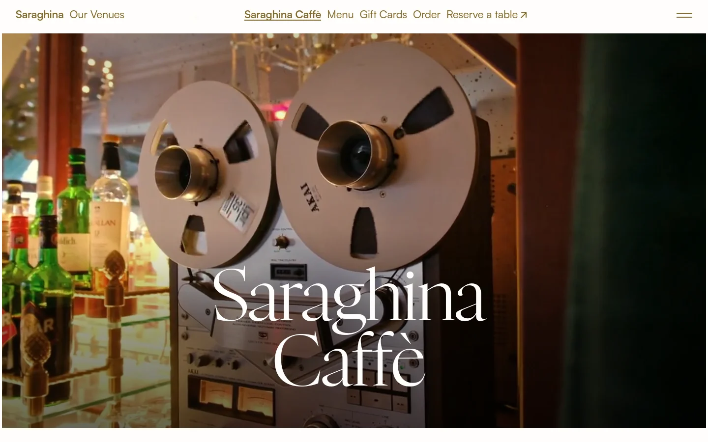 The desktop homepage features a large hero image of vintage film reels and bottles, with the title 'Saraghina Caffè' overlaid in white serif text. A navigation menu sits at the top with links for Menu, Gift Cards, Order, and Reserve a table. The layout uses a clean, elegant aesthetic with ample white space and high-quality food photography below the fold.