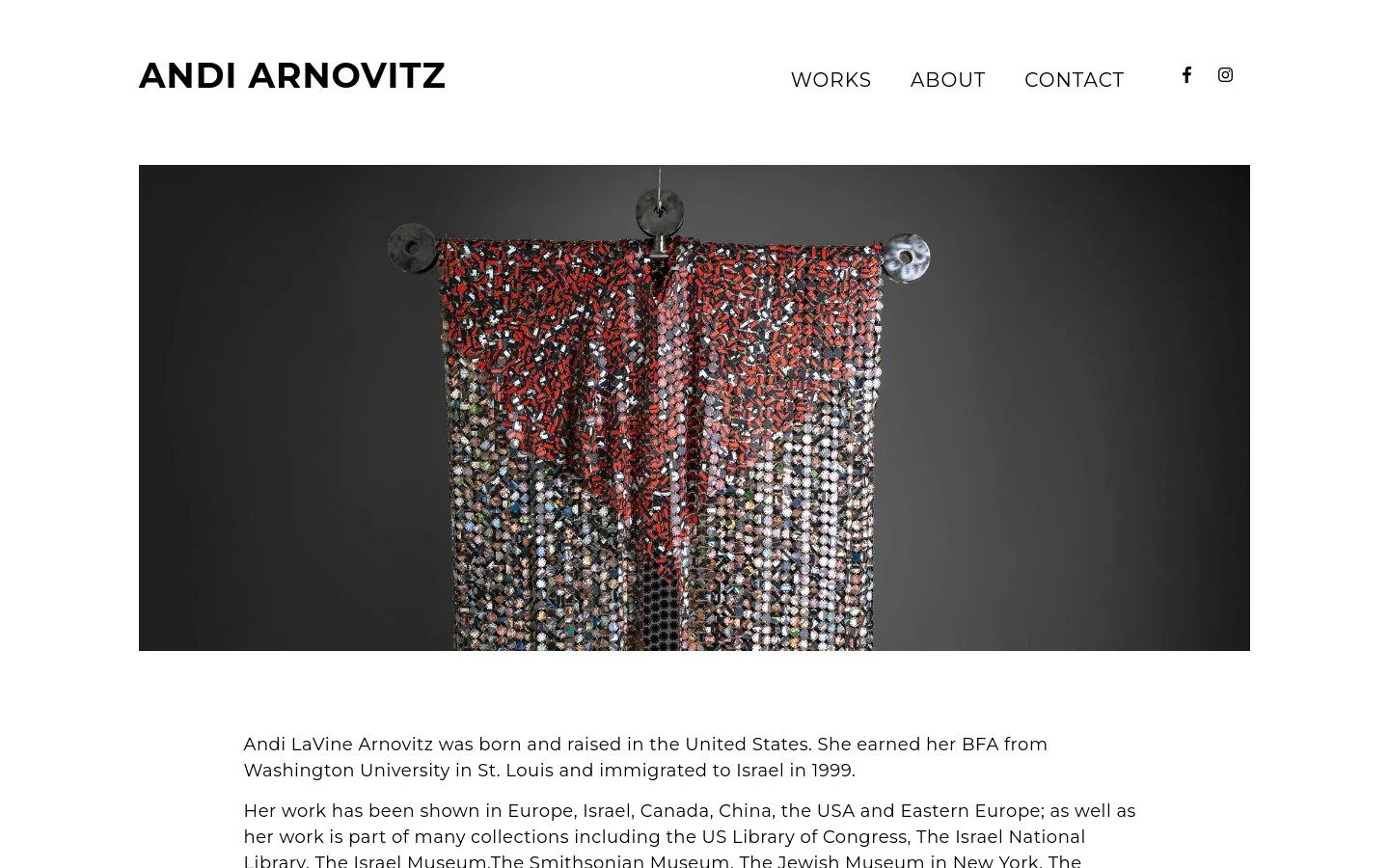 The desktop homepage for artist Andi Arnovitz features a clean, minimalist white background with black text. A large hero image displays a textured, beaded garment hanging against a dark gray background, positioned below a navigation menu containing links for Works, About, and Contact, along with social media icons.