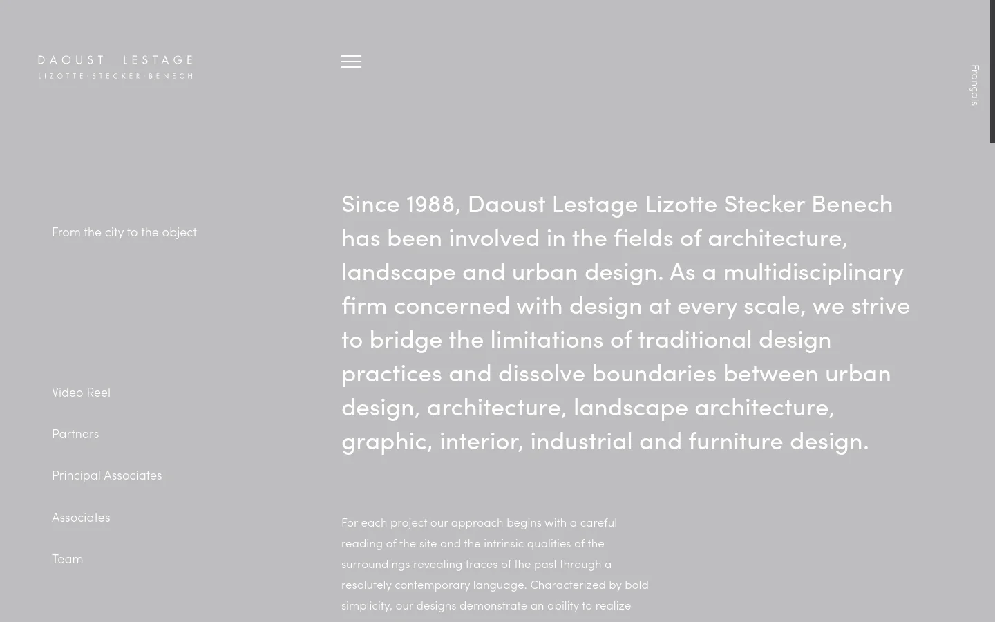 The desktop version features a minimalist design with a light gray background and white typography. A large heading describes the firm's multidisciplinary approach, while a navigation menu on the left includes links like 'From the city to the object' and 'Video Reel'. The company logo is positioned in the top left corner.