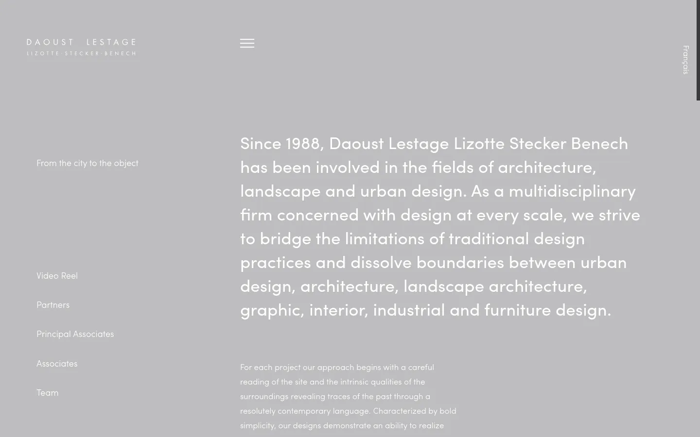 The desktop version features a minimalist design with a light gray background and white typography. A large heading describes the firm's multidisciplinary approach, while a navigation menu on the left includes links like 'From the city to the object' and 'Video Reel'. The company logo is positioned in the top left corner.