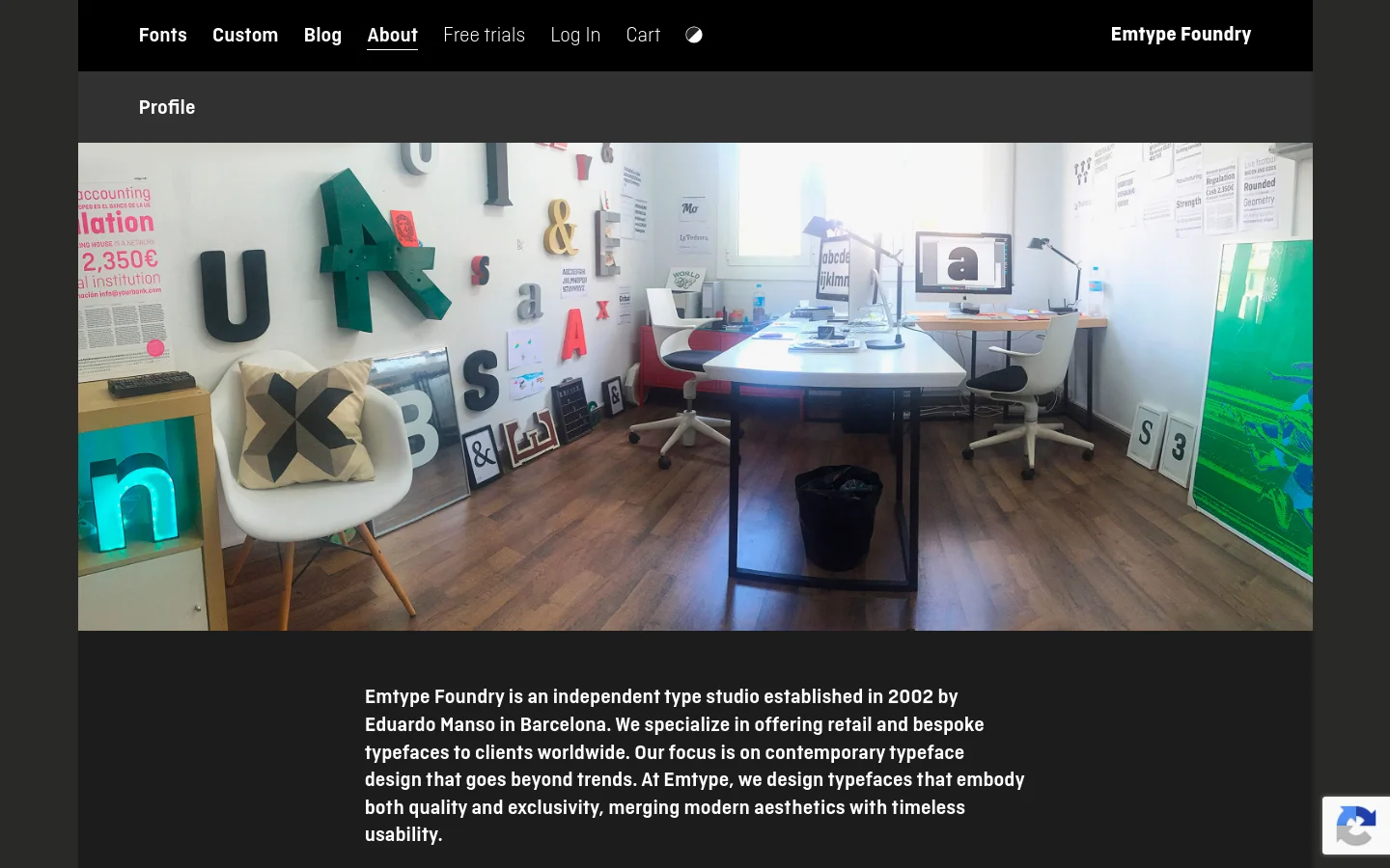 The desktop About page features a dark navigation bar with links like Fonts and Custom, followed by a large hero image of a bright, modern typography studio with desks and design posters. Below the image, a profile section uses bold white text on a dark background to describe Emtype Foundry, followed by a client logo grid.