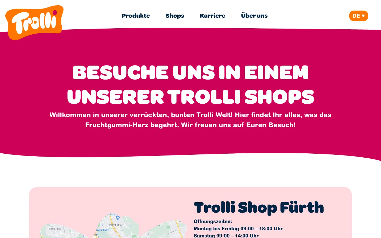 The desktop page features a white navigation bar with the Trolli logo and links for Produkte, Shops, Karriere, and Über uns. A large magenta hero section contains the headline 'BESUCHE UNS IN EINEM UNSERER TROLLI SHOPS' in bold white text, followed by a welcoming subheadline. Below, shop locations for Fürth and Hagenow are listed with opening hours, contact details, and 'ANFAHRT' buttons next to colorful product imagery.