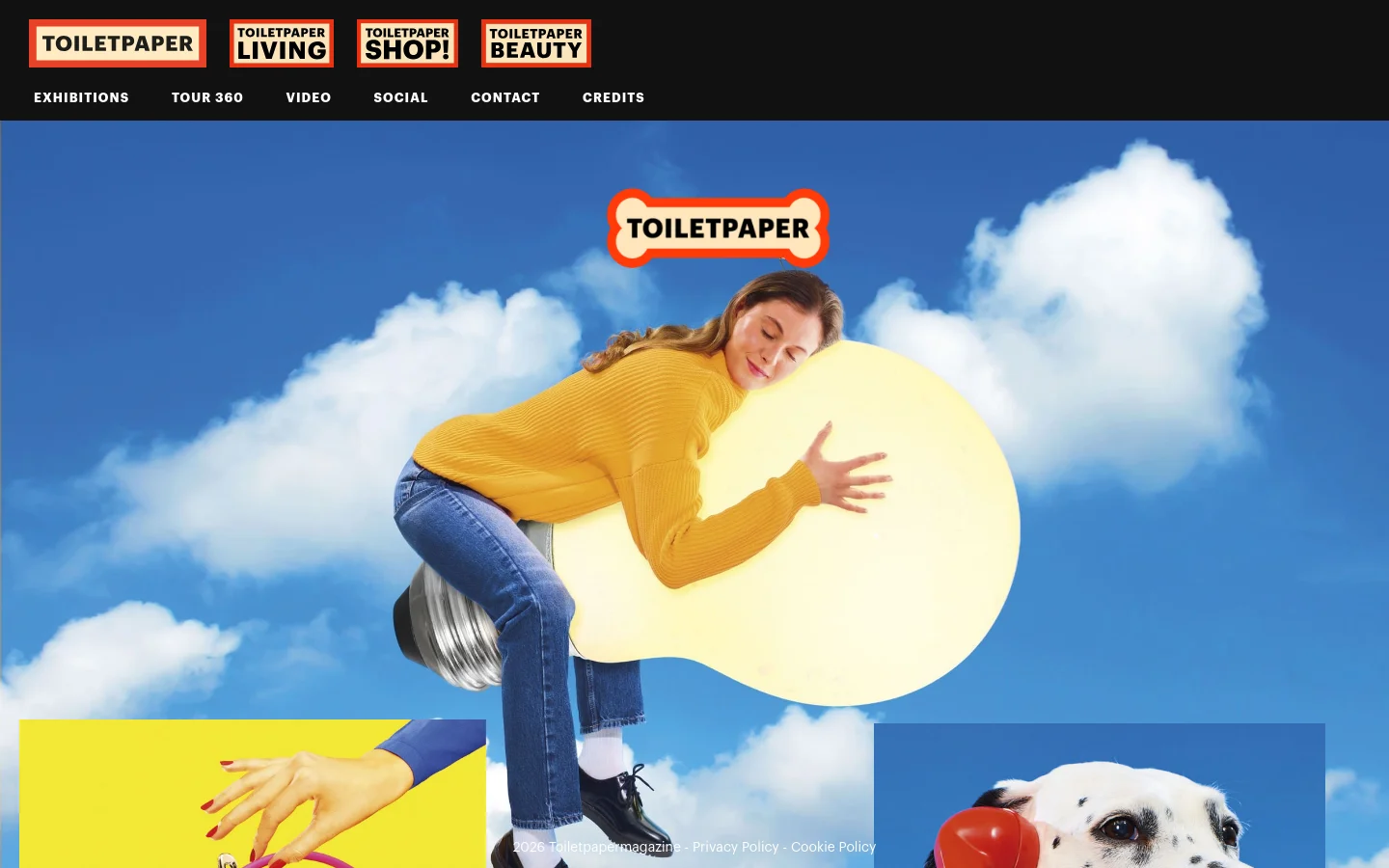 The desktop homepage features a large, surreal hero image of a woman hugging a giant lightbulb against a blue sky with white clouds. A black navigation bar at the top contains white text links for Exhibitions, Tour 360, Video, Social, Contact, and Credits, alongside colorful red and white brand logos. Below the hero image, a collage of vibrant, high-contrast photographic artworks is arranged in a grid.