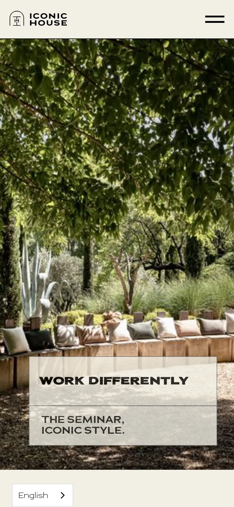 The mobile version simplifies the layout, displaying a full-width hero image of the garden with the same 'WORK DIFFERENTLY' text overlay. The top navigation is replaced by a minimalist header containing the Iconic House logo and a hamburger menu icon on the right, while the language selector appears as a button at the bottom.