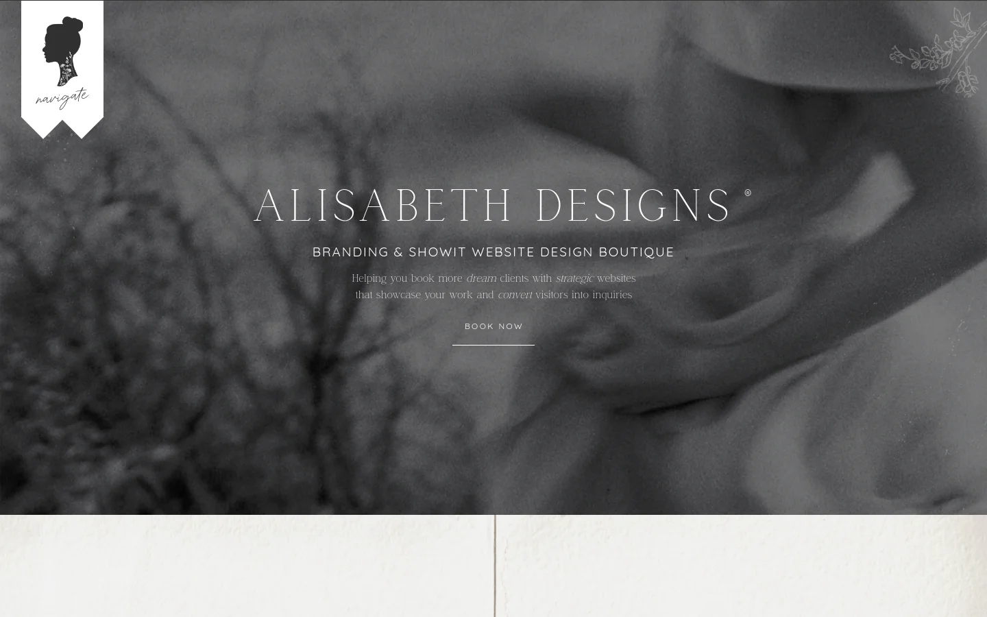 Desktop homepage for Alisabeth Designs featuring a large, moody black and white hero image with elegant serif typography. The layout includes a navigation menu, a headline about branding and Showit website design, a 'Book Now' call to action, and a section introducing founder Sarah Alisabeth with a portrait photo. The color palette is neutral with soft, organic textures.