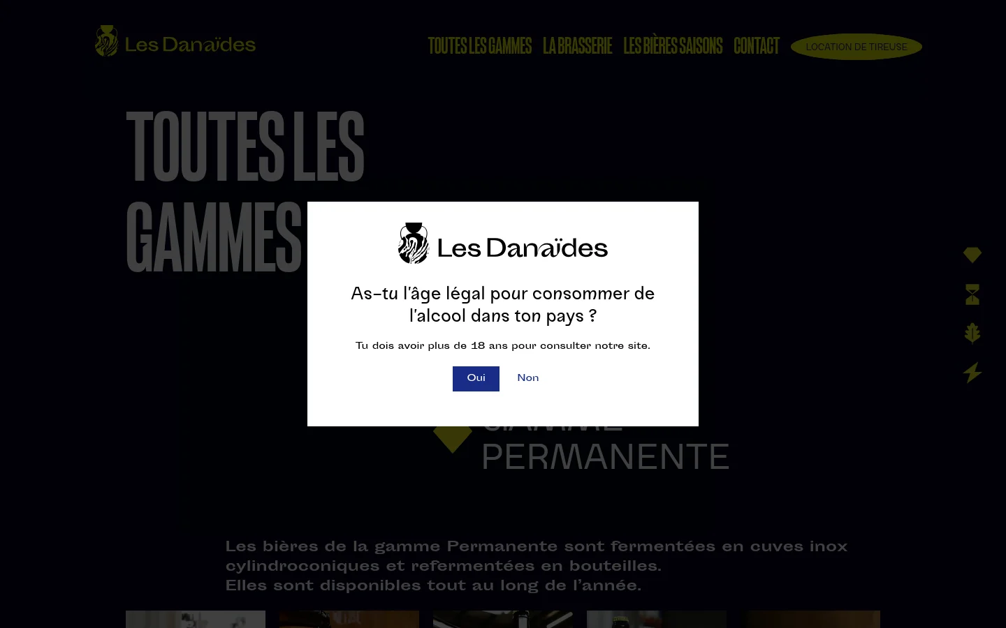 The desktop page features a dark theme with a large 'TOUTES LES GAMMES' headline in grey. A central age verification modal asks if the user is of legal drinking age, with 'Oui' and 'Non' buttons. The background shows a blurred brewery setting, and a navigation menu is visible at the top.