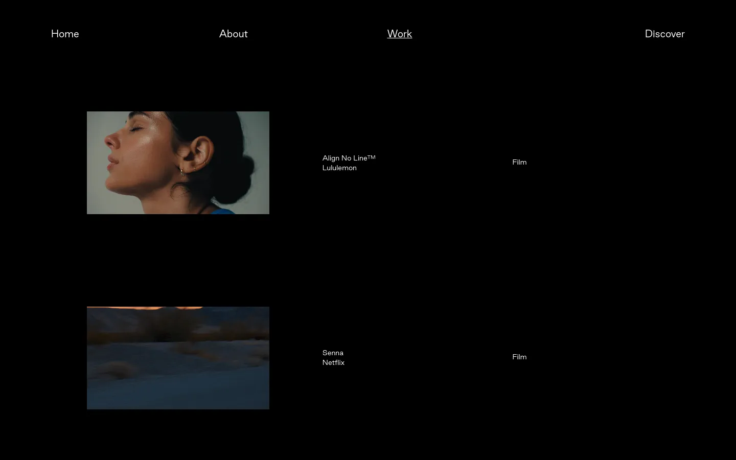 The Work page features a minimalist dark layout with a grid of project entries. Each entry consists of a rectangular thumbnail image on the left, followed by the project title, client name, and category (such as Film or Motion) in white text. The navigation menu at the top includes links for Home, About, Work, and Discover.