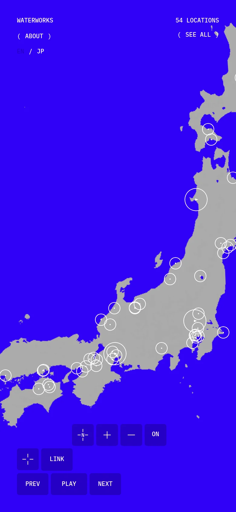 The mobile version maintains the high-contrast blue and gray map of Japan with white location markers. The layout is vertically oriented, with navigation links and playback controls repositioned to fit a narrower screen, primarily concentrated at the top and bottom edges.