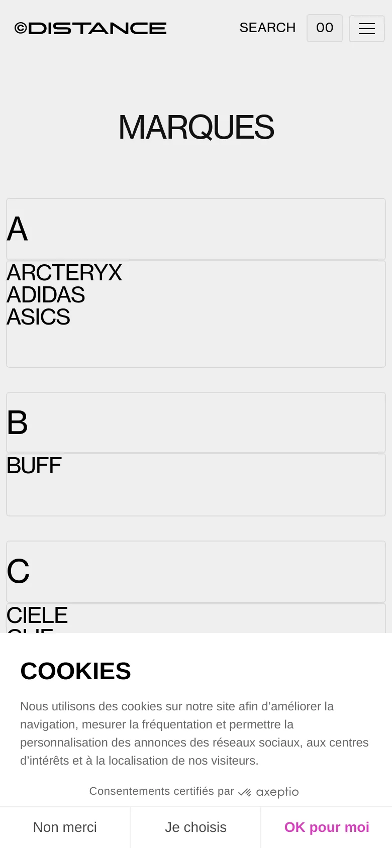 The mobile version maintains the minimalist white and grey aesthetic but uses a single-column vertical layout for the brand list. The header is condensed with a hamburger menu icon and a search option, while the large 'MARQUES' title remains centered above the alphabetical brand groupings.