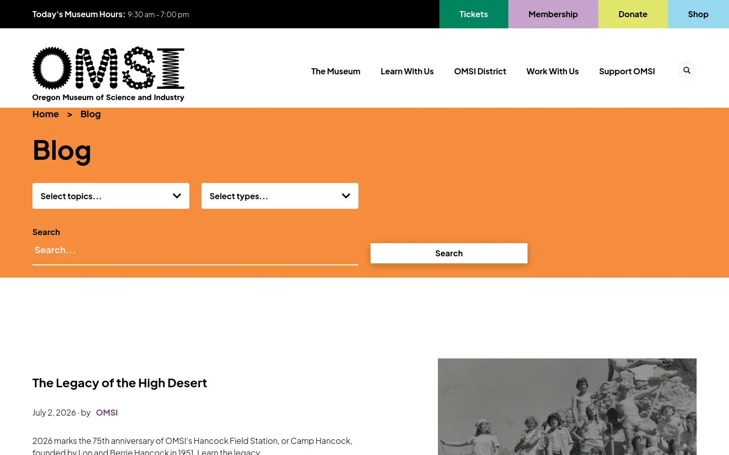 The OMSI Blog desktop page features a large orange header containing the title 'Blog', two dropdown menus for topics and types, and a search bar. Below the header, a blog post titled 'The Legacy of the High Desert' is displayed with a black and white group photograph. The navigation menu includes links for The Museum, Learn With Us, OMSI District, Work With Us, and Support OMSI.
