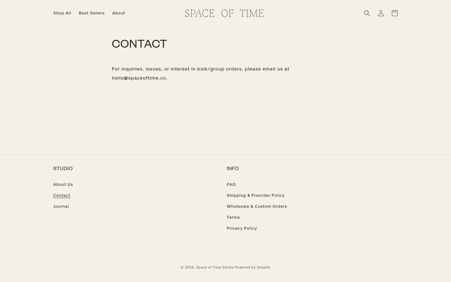 The desktop Contact page features a minimalist design with a light beige background and dark text. A centered headline reads 'CONTACT' above a brief instruction to email hello@spaceoftime.co for inquiries. The navigation bar at the top includes links for Shop All, Best Sellers, and About, alongside search, user, and cart icons, while the footer contains organized links under 'STUDIO' and 'INFO' headings.