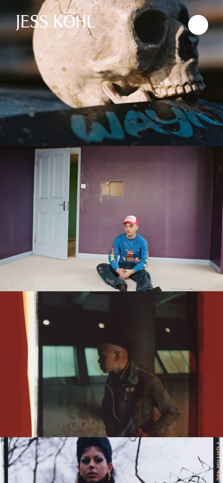 The mobile version presents a vertical, single-column scrolling layout of the photography stills. The navigation menu is condensed into a circular icon in the top right corner, and the large-scale imagery dominates the screen for a focused viewing experience.