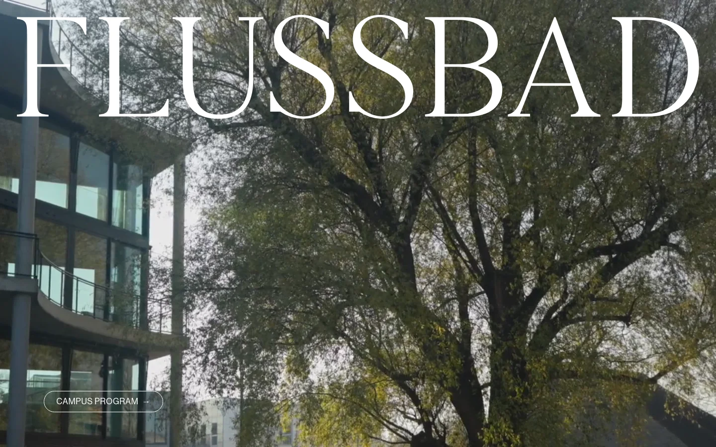 The desktop homepage features a large hero image of a modern glass building next to a large leafy tree, with the word 'FLUSSBAD' in large white serif typography overlaid at the top. A 'CAMPUS PROGRAM' call-to-action button is positioned in the lower-left corner. The layout is minimalist with a clean, airy aesthetic dominated by natural tones and architectural lines.