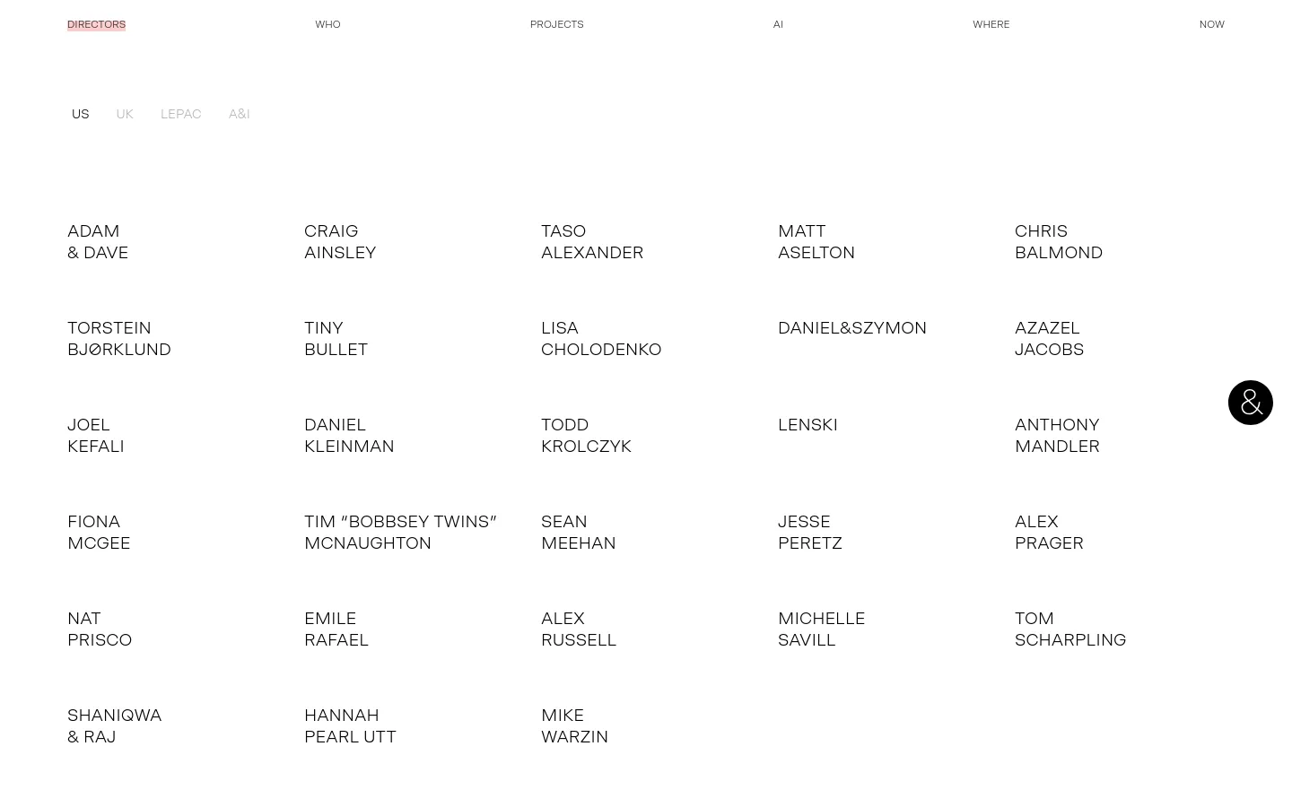 The desktop page features a minimalist white layout with a navigation menu at the top including links for Who, Projects, AI, Where, and Now. Below the header, a sub-navigation allows filtering by US, UK, LePac, or A&I, followed by a large grid of director names in black uppercase text. A small black circular icon with a stylized 'a' is positioned on the right side of the screen.