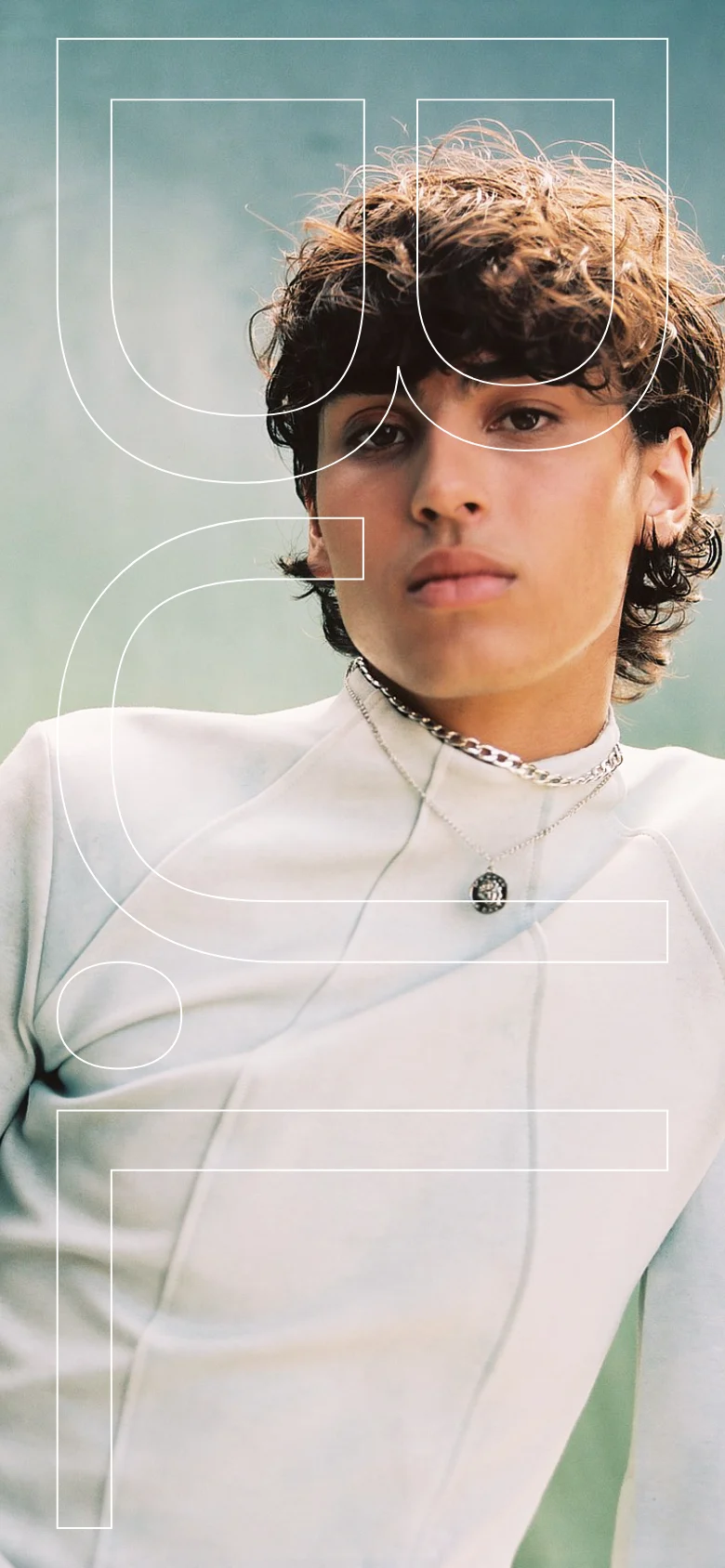 The mobile version presents a single-column vertical scroll of the large-scale fashion imagery. The text content and navigation links are repositioned below the image gallery, maintaining the minimalist aesthetic while optimizing the layout for a narrow screen.