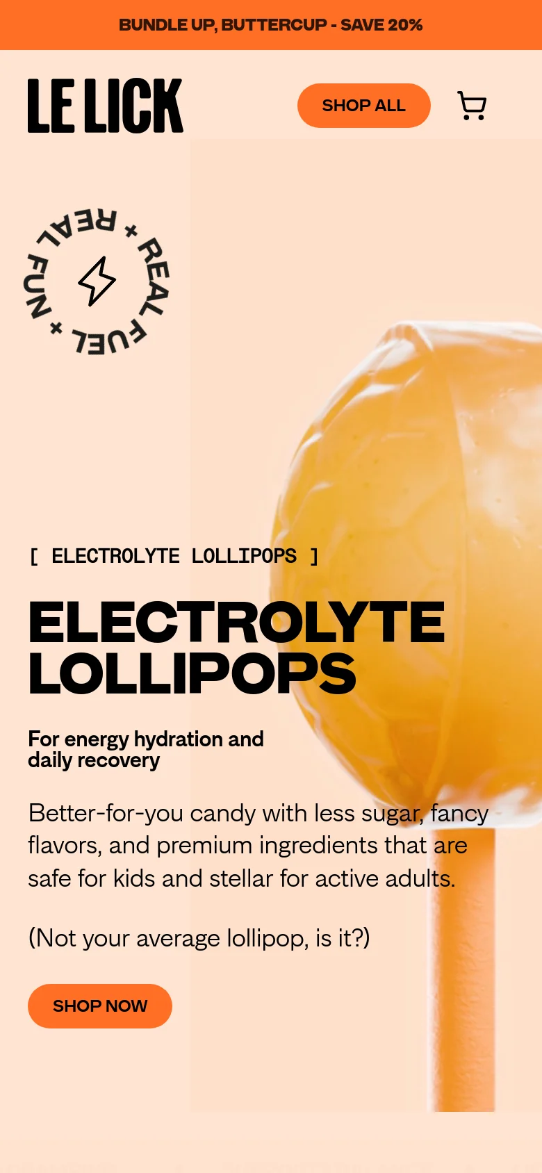 The mobile version uses a similar peach color palette but rearranges the layout for a vertical screen. The hero image of the lollipop is positioned behind the text, and the 'Le Lick' logo, 'Shop All' button, and cart icon are stacked at the top. The headline and 'Shop Now' button are centered to accommodate the narrower viewport.