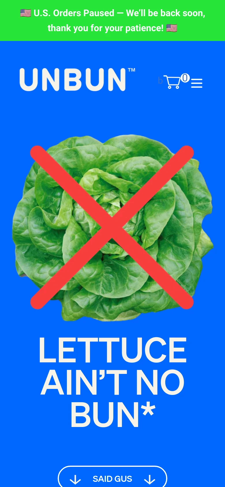 The mobile version presents a vertically stacked layout with the same blue hero section, featuring the lettuce with a red X and the large white headline above the image. The navigation menu is condensed into a hamburger icon next to a shopping cart, and the 'SAID GUS' call-to-action button is centered below the main graphic.
