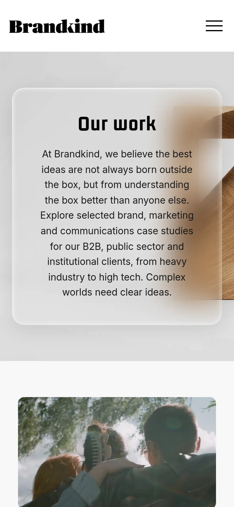 The mobile version presents a vertically stacked layout where the hero section's text and 3D wooden sculpture are centered within a rounded white card. The navigation is condensed into a hamburger menu icon at the top right, and the case study content follows in a single-column scrollable format.
