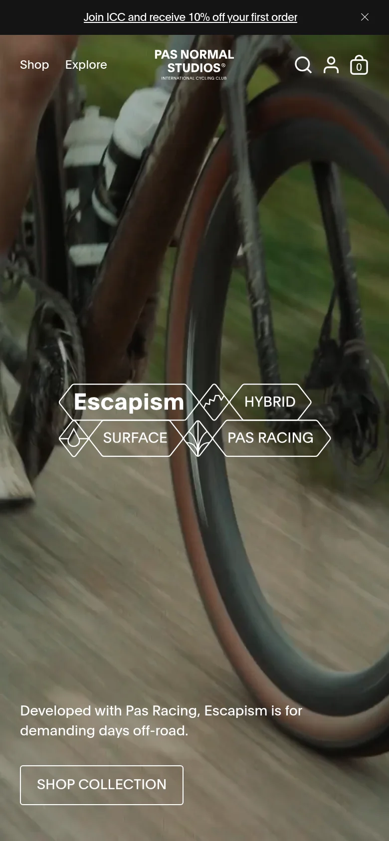 The mobile version maintains the cinematic cycling video background but uses a simplified layout. The navigation is condensed to 'Shop' and 'Explore' at the top left, with search, account, and cart icons on the right. The geometric text overlays are stacked vertically in the center, and the 'Shop Collection' button is prominently placed at the bottom left.