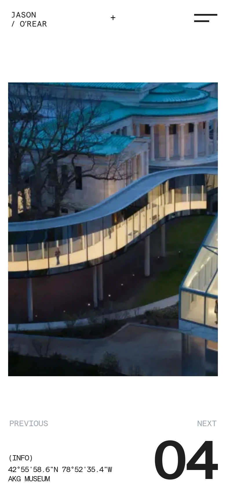 The mobile version presents a vertically stacked layout centered around a large architectural photograph of a curved glass building. The minimalist design is maintained with the photographer's name in the top left, a menu icon in the top right, and project information like '04' and 'AKG MUSEUM' positioned below the image.