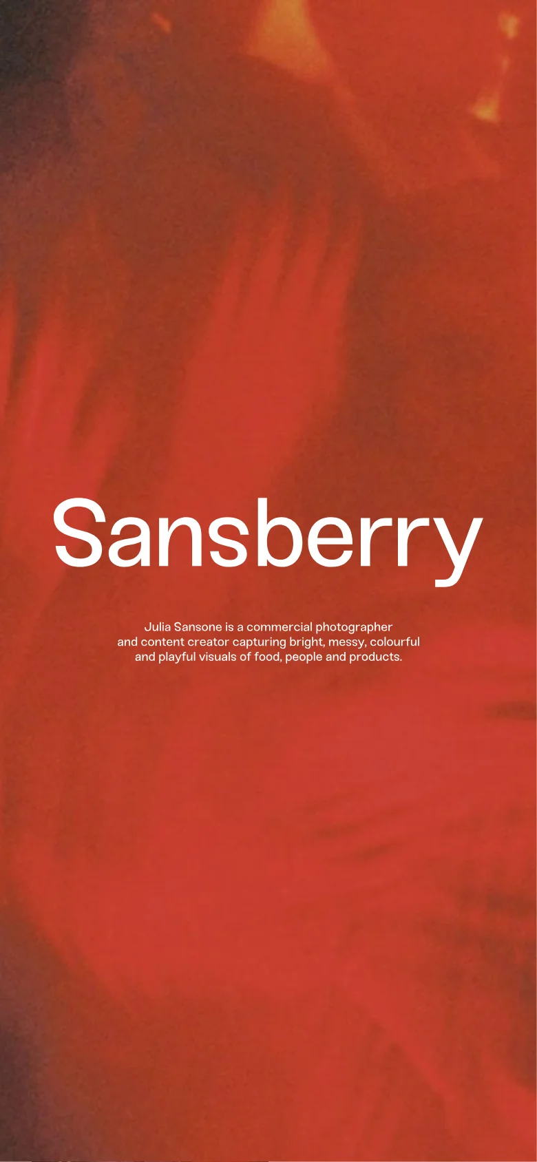 The mobile version presents a vertical, single-column layout optimized for scrolling. A large, full-screen hero section features a vibrant red textured background with the white 'Sansberry' title and a brief professional bio. Navigation and footer elements are repositioned to fit the narrow screen width.
