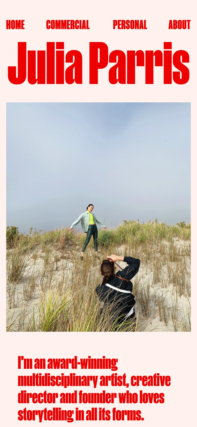 The mobile version presents a simplified, vertically stacked layout with the name 'Julia Parris' in large red text at the top. The navigation links are moved to a single row above the name, and the hero image is a full-width photograph of a person in a grassy landscape. The introductory text follows below the image in a single column, maintaining the minimalist aesthetic and high-contrast red and white color scheme.