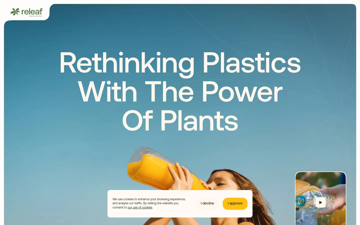 The desktop homepage features a large hero section with a blue gradient background and the headline 'Rethinking Plastics With The Power Of Plants' in bold white text. Below the text, a person is shown drinking orange juice from a clear bottle. A cookie consent banner appears at the bottom, and a small video thumbnail is visible in the bottom right corner.