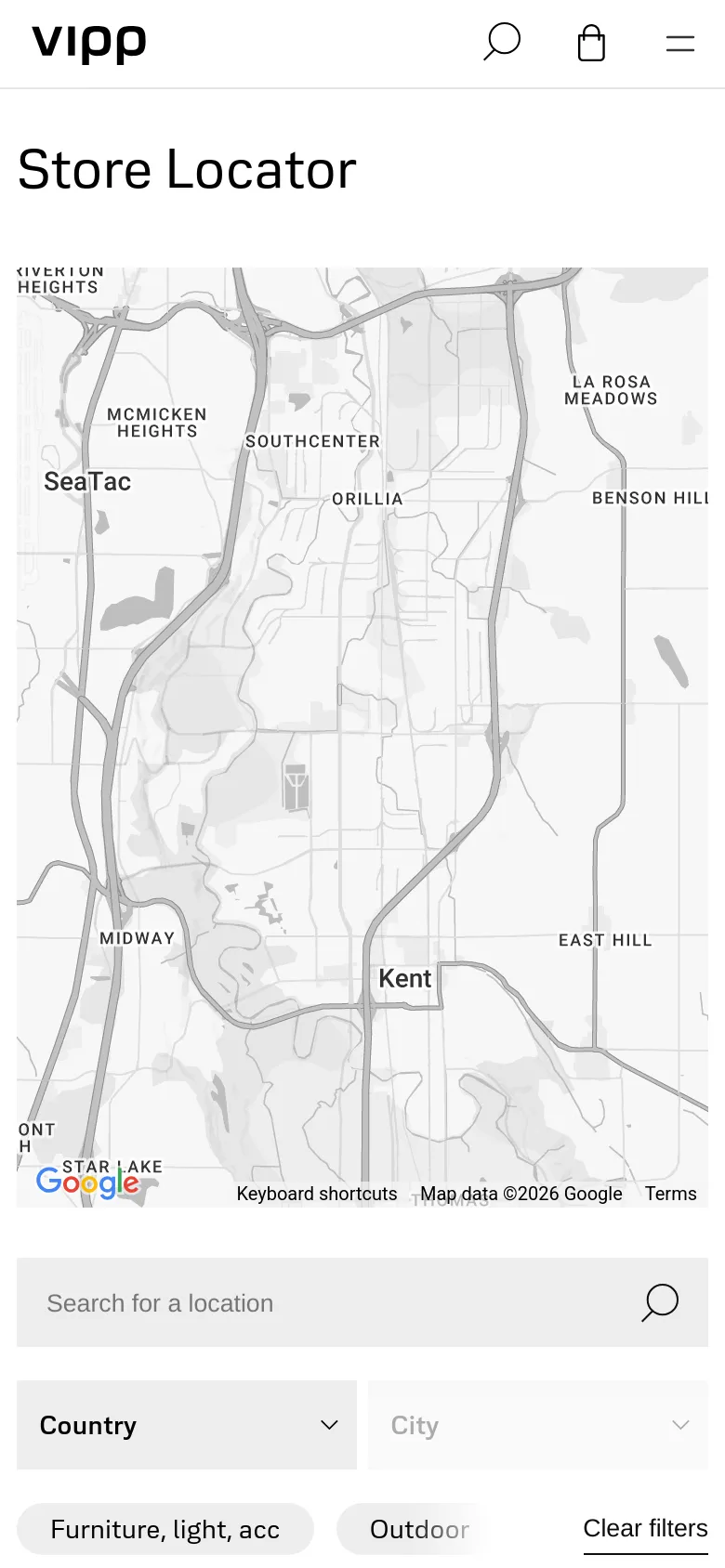 The mobile version presents a vertically stacked layout with the 'Store Locator' headline at the top, followed by the grayscale Google Map. The search bar, country and city dropdowns, and filter chips are positioned below the map for easier scrolling on a smaller screen.