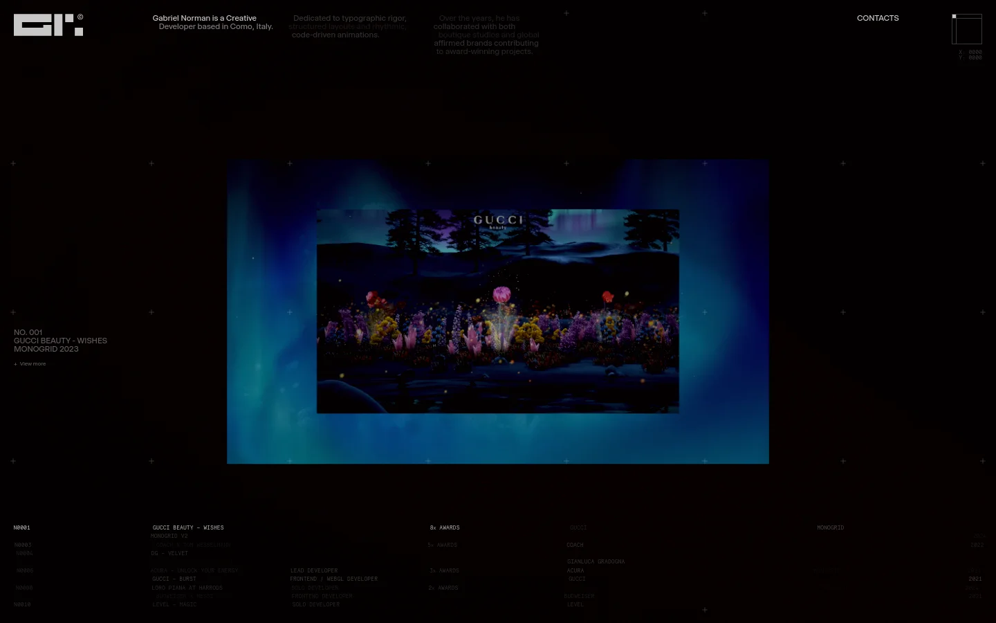 A dark-themed portfolio website for creative developer Gabriel Norman featuring a large, cinematic hero image of a floral landscape under a blue night sky. The layout uses a minimalist grid with white typography on a black background, displaying project titles like 'Gucci Beauty - Wishes' and navigation links for 'Contacts' and social media. A subtle grid of small '+' icons overlays the dark background.