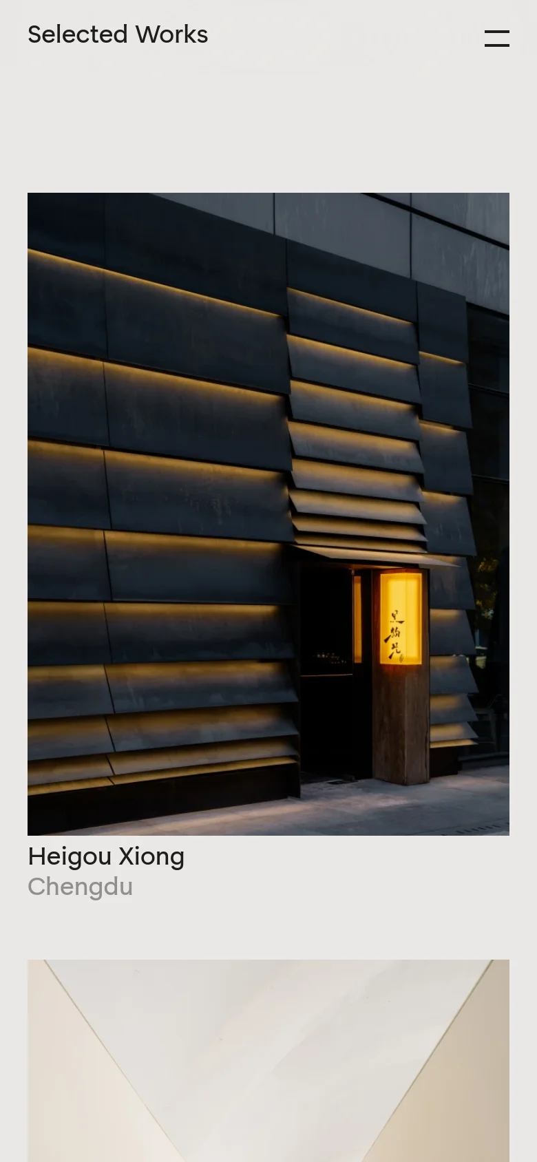The mobile version presents a single-column vertical scroll of the Selected Works portfolio. The layout prioritizes large, full-width imagery for each project, followed by the project name and location in a clean, sans-serif font. The navigation is condensed into a hamburger menu icon in the top right corner.