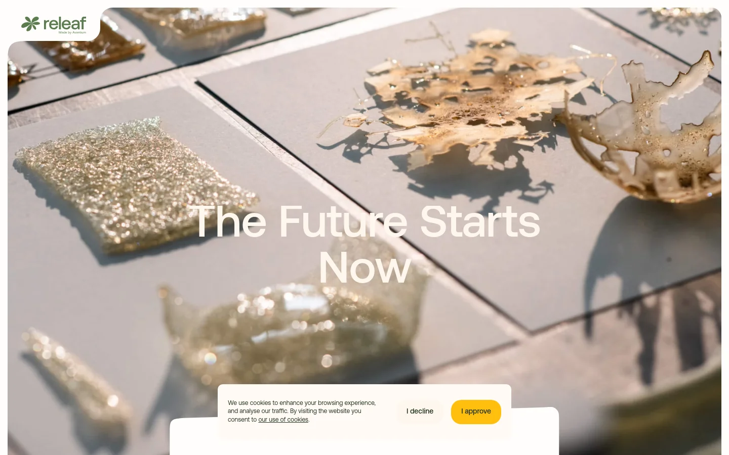The desktop page features a large hero image of translucent, organic-shaped bio-material samples on a light surface, overlaid with the headline 'The Future Starts Now'. Below the hero section, white space is used for text describing Releaf's mission and a 'Get in Touch' call to action button. The layout is clean with a minimalist aesthetic and a cookie consent banner at the bottom.