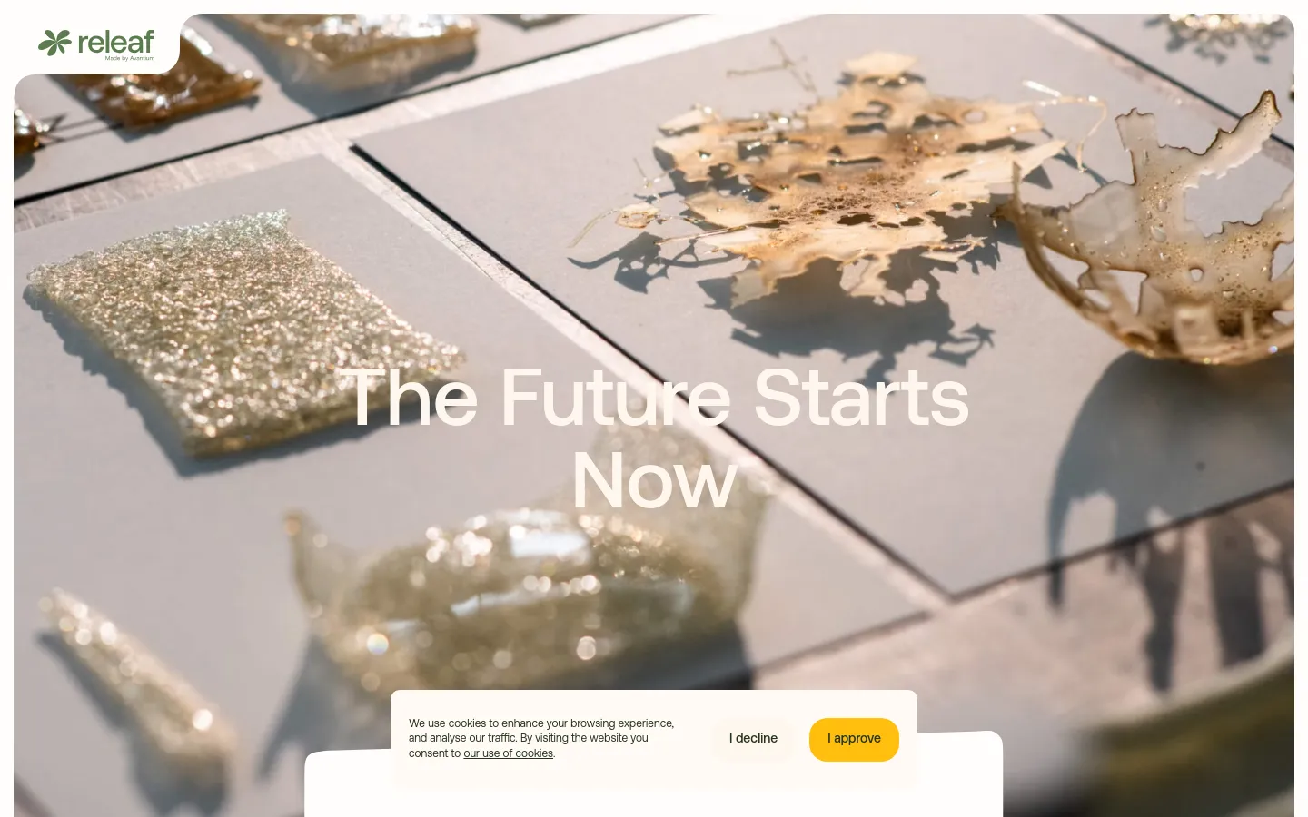 The desktop page features a large hero image of translucent, organic-shaped bio-material samples on a light surface, overlaid with the headline 'The Future Starts Now'. Below the hero section, white space is used for text describing Releaf's mission and a 'Get in Touch' call to action button. The layout is clean with a minimalist aesthetic and a cookie consent banner at the bottom.