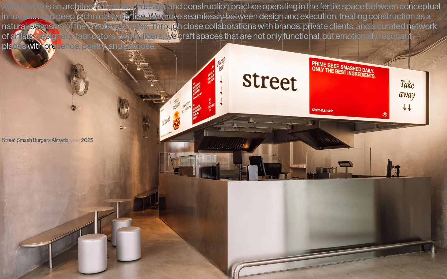 The XXXI.studio homepage features a minimalist design with a large, full-width hero image of a modern stainless steel restaurant interior. Below the hero section, a grid of project tiles displays large photography paired with project titles and years, such as 'Street Smash Burgers Almada' and 'Ugly Smash Burgers'. The layout is clean with a neutral color palette and white text overlays.