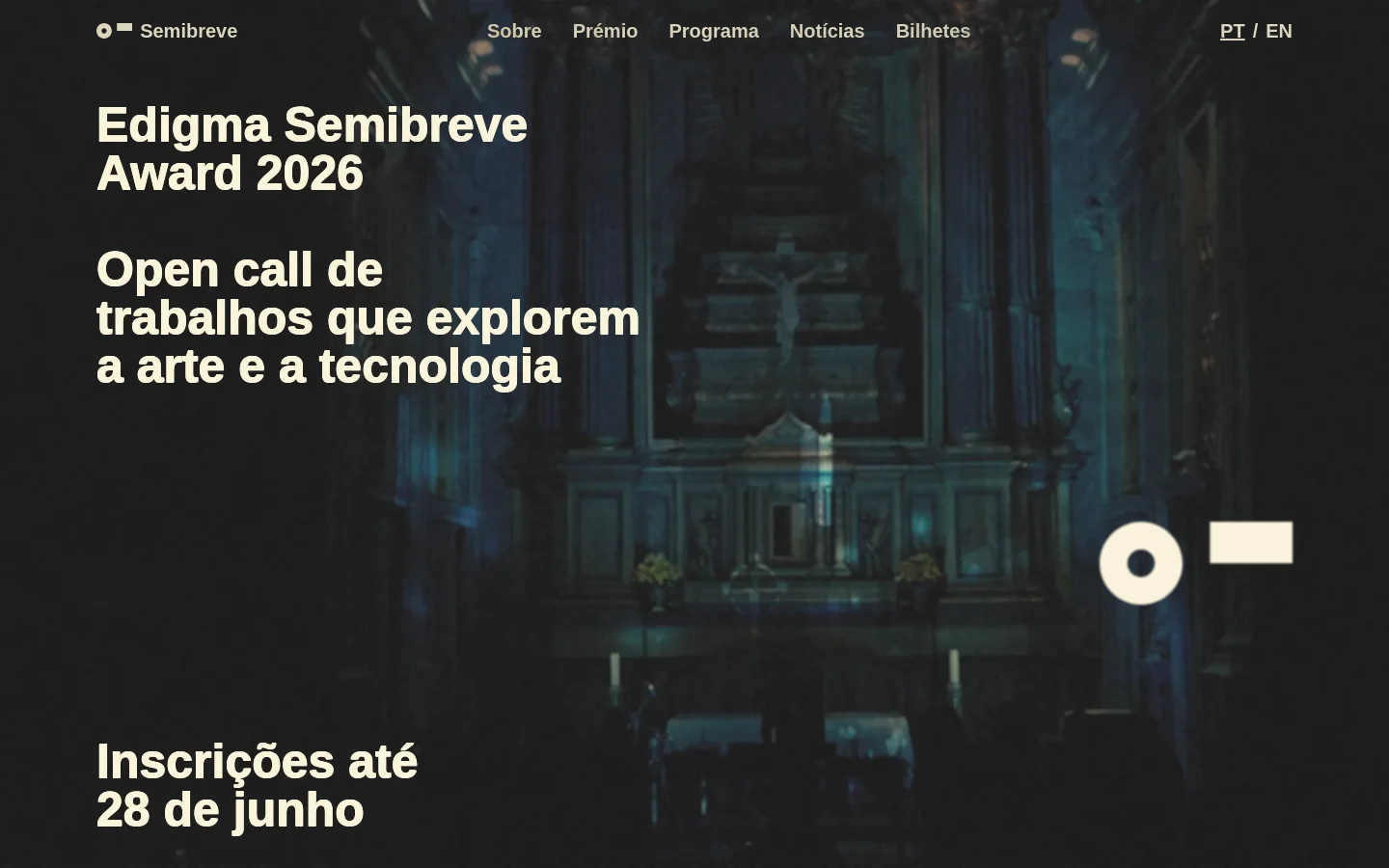 The desktop homepage features a dark, atmospheric background image of a dimly lit interior with teal and gold tones. Large white typography announces the 'Edigma Semibreve Award 2026' and an open call for art and technology, alongside a registration deadline. A navigation menu at the top includes links for About, Award, Program, News, and Tickets, with language toggles on the right.