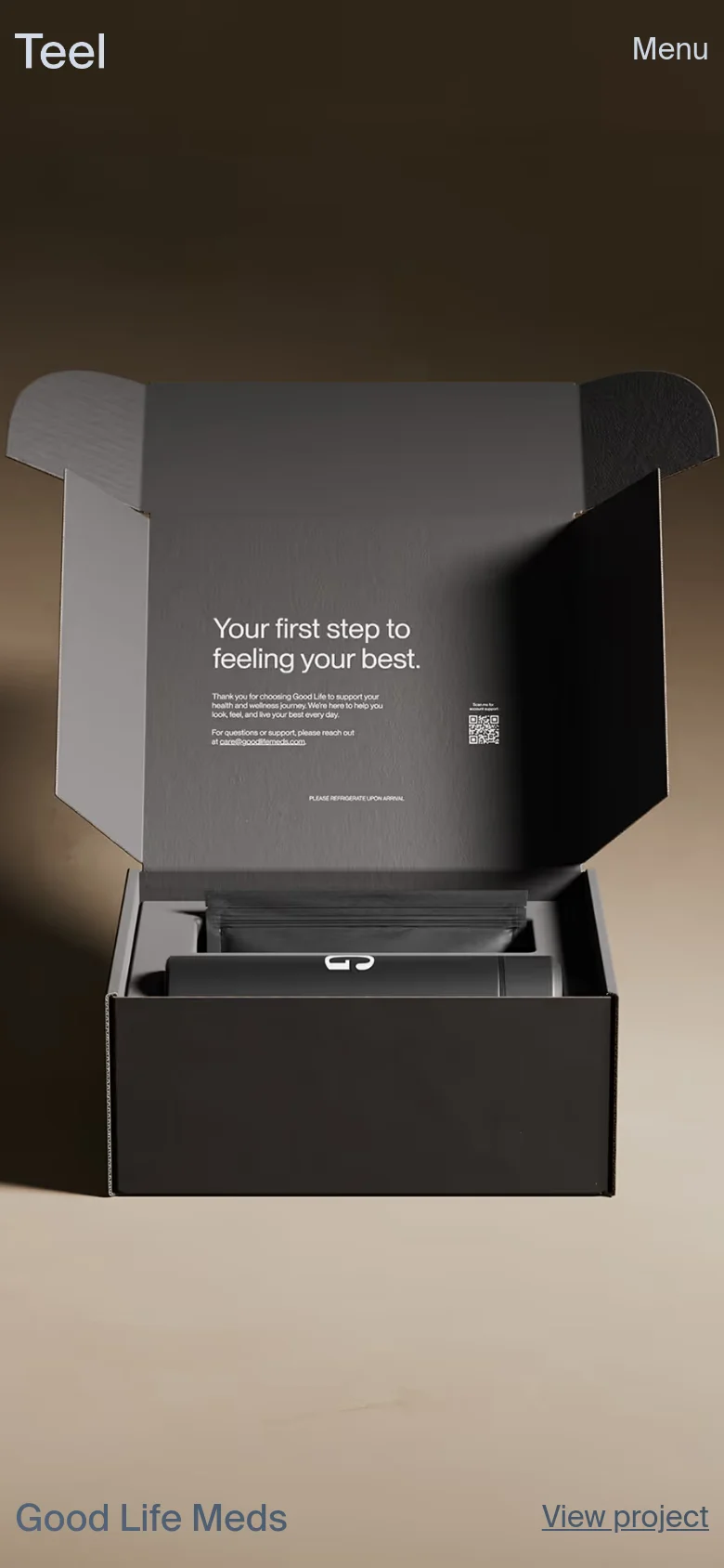 The mobile version maintains the dark, minimalist aesthetic but uses a simplified layout. The navigation is condensed into a 'Menu' button in the top right, while the hero imagery of the black product boxes remains centered and prominent above the project title and link.